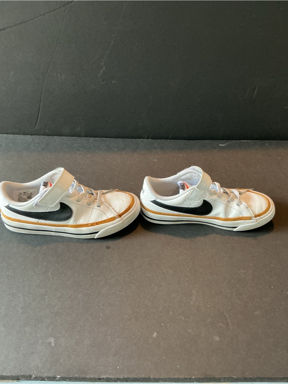 Nike Kids White Sneakers with Black Swoosh and Tan Trim